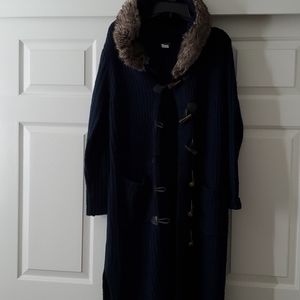 This is a beautiful coat with fur hood and elephant buttons. Nice and warm.
